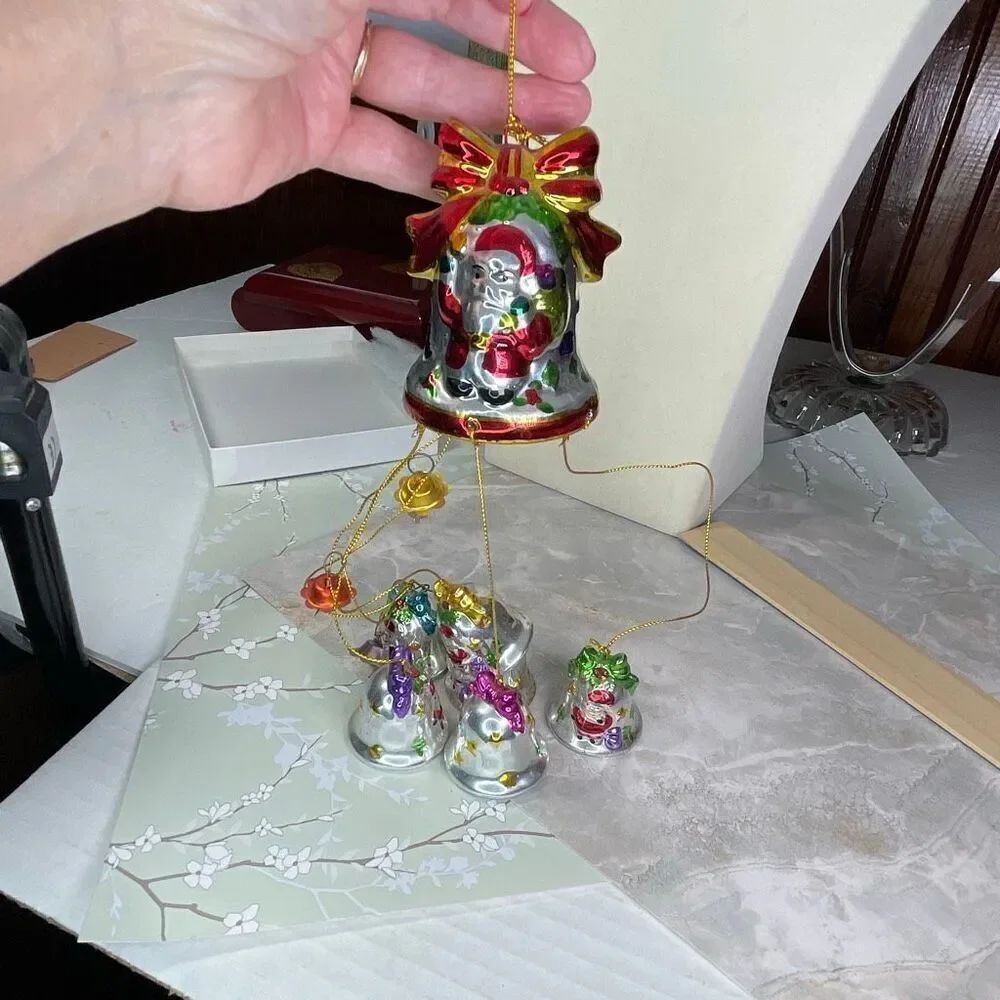 Vintage 1998 Avon Santa “Shimmering Bell ornament with Chimes”.
